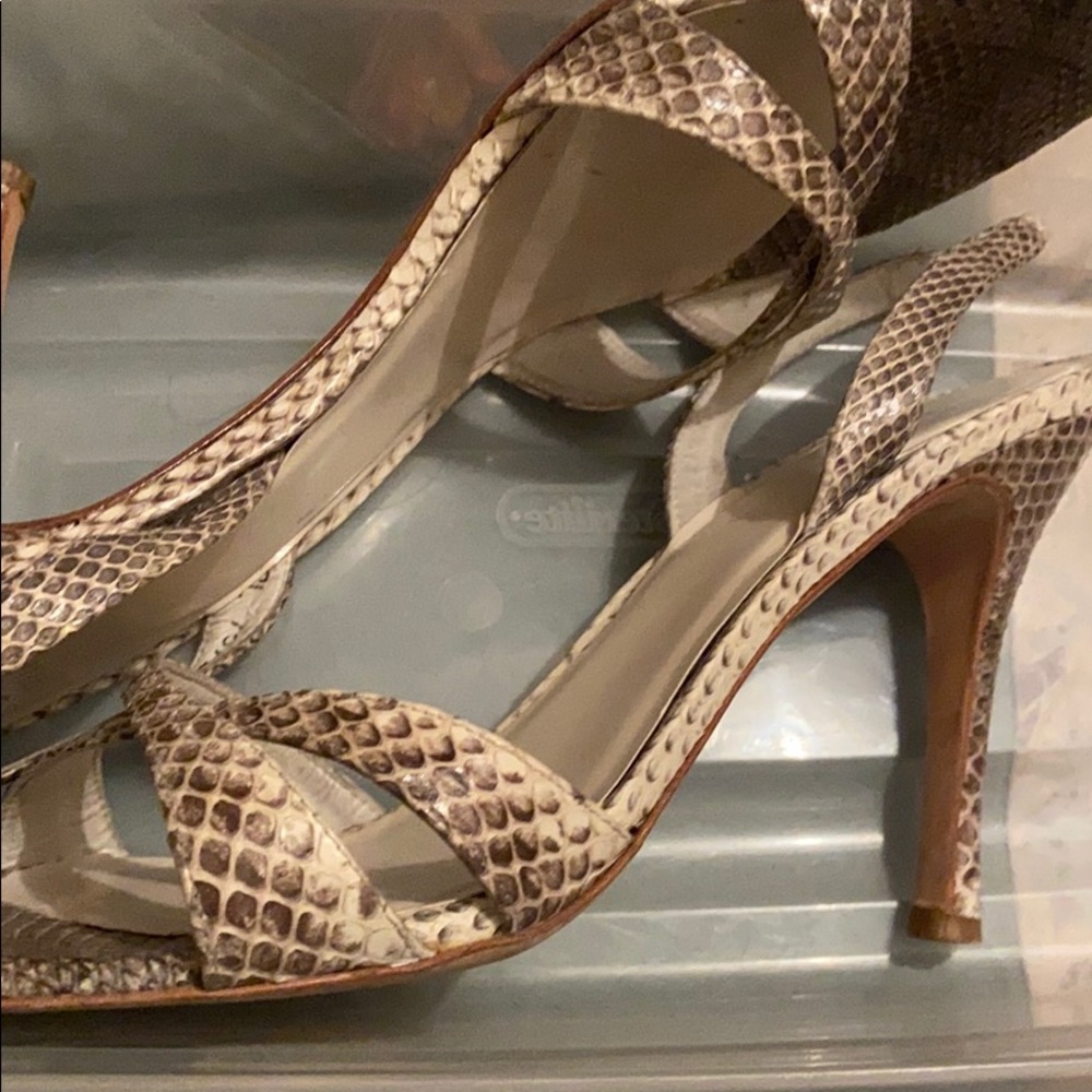Stuart Weitzman snake skin and leather sole heels.